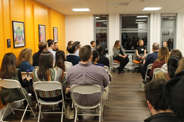 Guests listening to speakers 3 copy.jpg